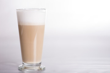 GLASS WITH COFFEE AT shallow depth of field