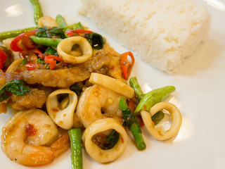 Rice with stir-fried seafood and basil