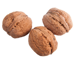 Three walnuts isolated on white background