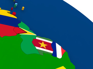 Guyana, Suriname and French Guiana on globe with flags