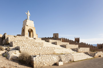 Statue of Jesus and ruins of city wall, Almeria, Spain