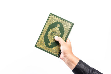 Koran in hand ,Quran in hand  - holy book of Muslims , on white background