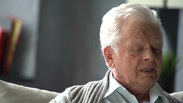 Portrait of sad senior retired man, lonely grandfather, depressed looking, very upset