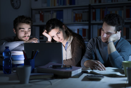 Sleepy Teenagers Studying Late At Night