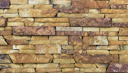 wall of old golden travertine facing brick