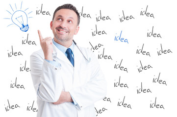 Excited handsome successful doctor pointing a great idea