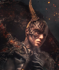 Portrait of devil woman with horn.