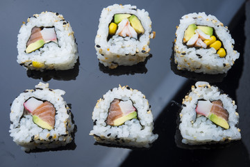 Sushi set isolated on black background