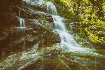 Fototapeta na wymiar Vintage retro effect filtered hipster style image of tropical waterfall 