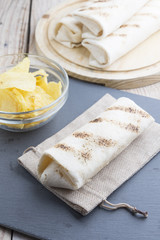 Homemade beef burritos with vegetables, potato chips