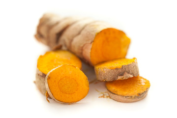 Collection of sliced fresh Organic Long Turmeric or Haldi (Curcuma longa) isolated on white background.