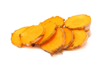 Collection of sliced fresh Organic Long Turmeric or Haldi (Curcuma longa) isolated on white background.