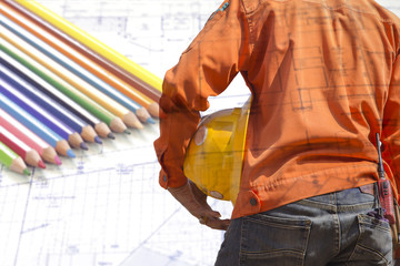 engineer holding yellow helmet for workers security on white background