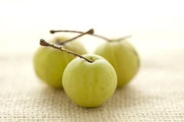 Collection of Organic Indian gooseberry or Amla (Phyllanthus emblica) on jute mat.