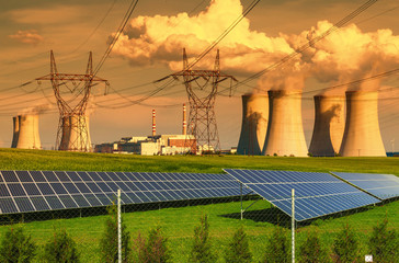 Nuclear power plant Dukovany with solar panels at sunset in Czech Republic

