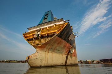 Partially broken down ocean ship at a shipbreaking yard in Chittagong, Bangladesh