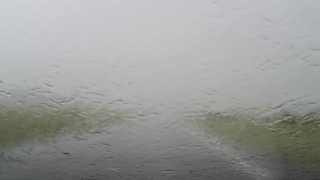 Driving a car through heavy rain