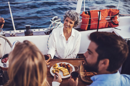 People having meal on yacht