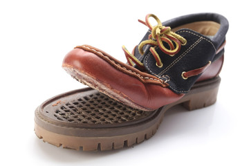 torn shoe on a white background isolate.