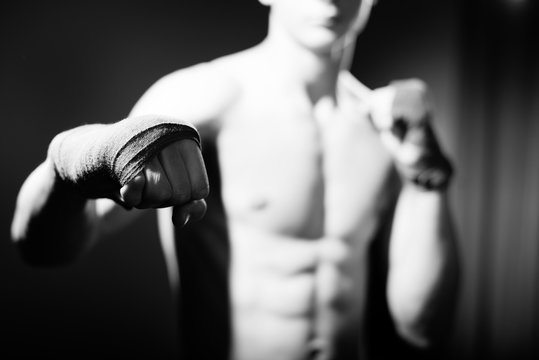Black white photography of athlete with tape on the hand