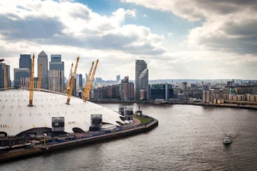 Aerial view of River Thames, North Greenwich and the Docklands on a cloudy day in London, England, UK © Victor Moussa