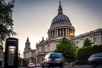 Fototapeta na wymiar St Paul’s cathedral with traffic creating light trails
