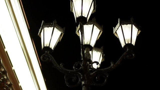 The night streets of the city. Street light with five lamps in a classical style