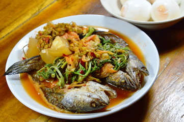 deep fried striped snake head fish in mixed hot and sour soup eat with boiled egg