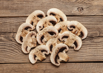 sliced mushrooms on the old board