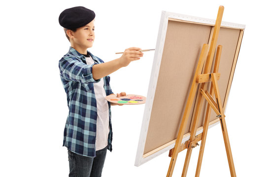 Little kid painting on a canvas