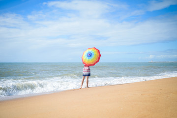 Obraz premium Excited romantic female having fun on beach walk on sunny outdoors background 
