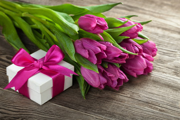 tulips and gift box on the board.