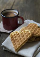 heart shaped waffles and coffee on table