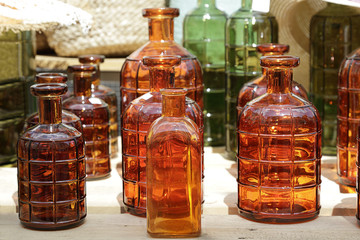 Decorative glass bottles for sale at a street market