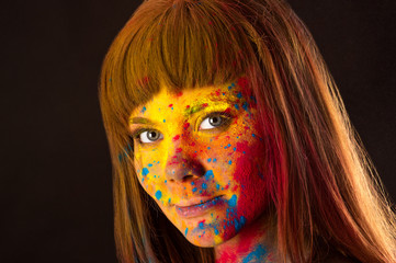 charming portrait woman in colors Holi closeup