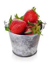 strawberry in metallic bucket isolated on white