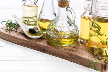 Oils on vintage wooden background . healthy food