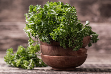 tied fresh parsley on wooden surface, healthy food