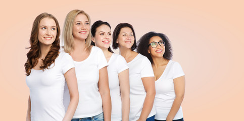 Fototapeta premium group of happy different women in white t-shirts