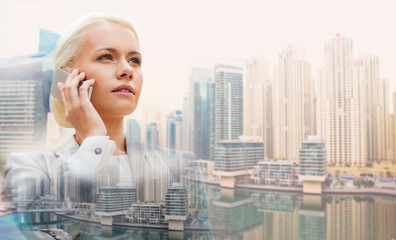 serious businesswoman with smartphone outdoors