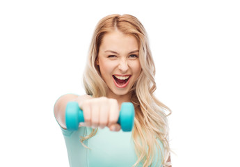 smiling beautiful young sporty woman with dumbbell