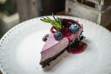 fresh blueberries cheese pie and chocolate biscuits