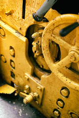 Old abandoned industrial engine that was used in mining industry in the past. Detail of devices for driving inside cab