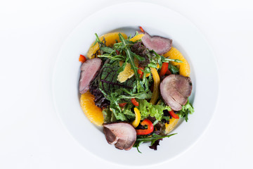 Fresh salad with ham and greens