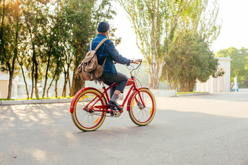Fototapeta na wymiar female riding vintage bicycle in park 