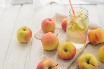 fresh rustic concept, apples on a white rag on the wooden background