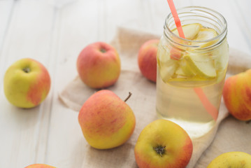 fresh rustic concept, apples on a white rag on the wooden background