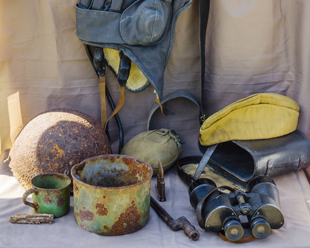 Objects of the Great Patriotic War. Helmet, headset, bowler, glasses, cup, field cap, canteen, ammunition, a bayonet