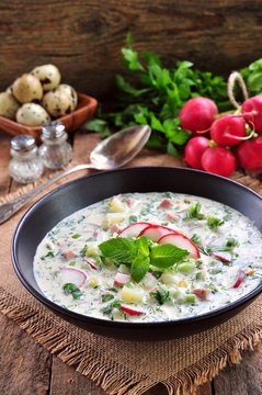 Cold summer soup with radish, cucumber, dill, parsley boiled eggs and potatoes. Russian traditions.
