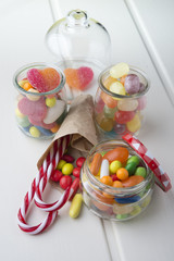 Multicolor candies in glass jars